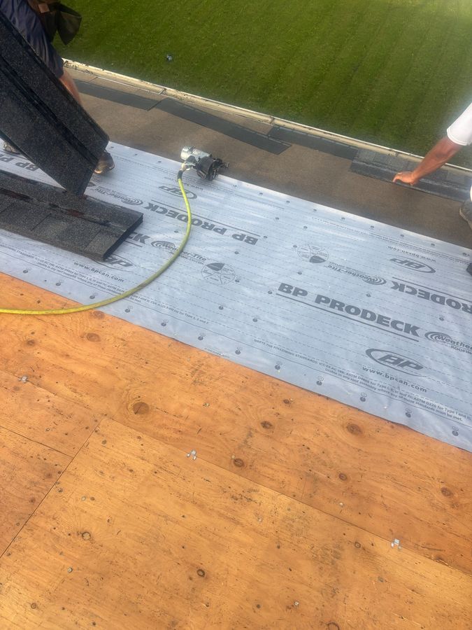BP ProDeck underlayment being installed over roof decking during professional roof replacement in Yorkton
