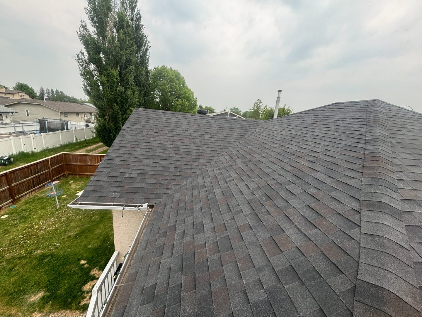 Completed dark hip roof on home near Wroxton Saskatchewan