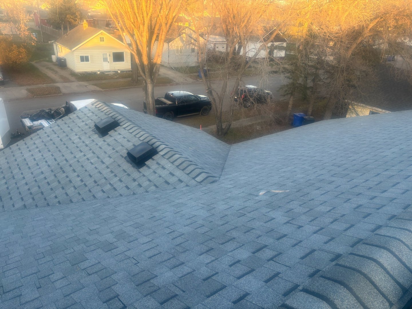 Completed roof replacement at golden hour in Yorkton Saskatchewan by Molnar Roofing