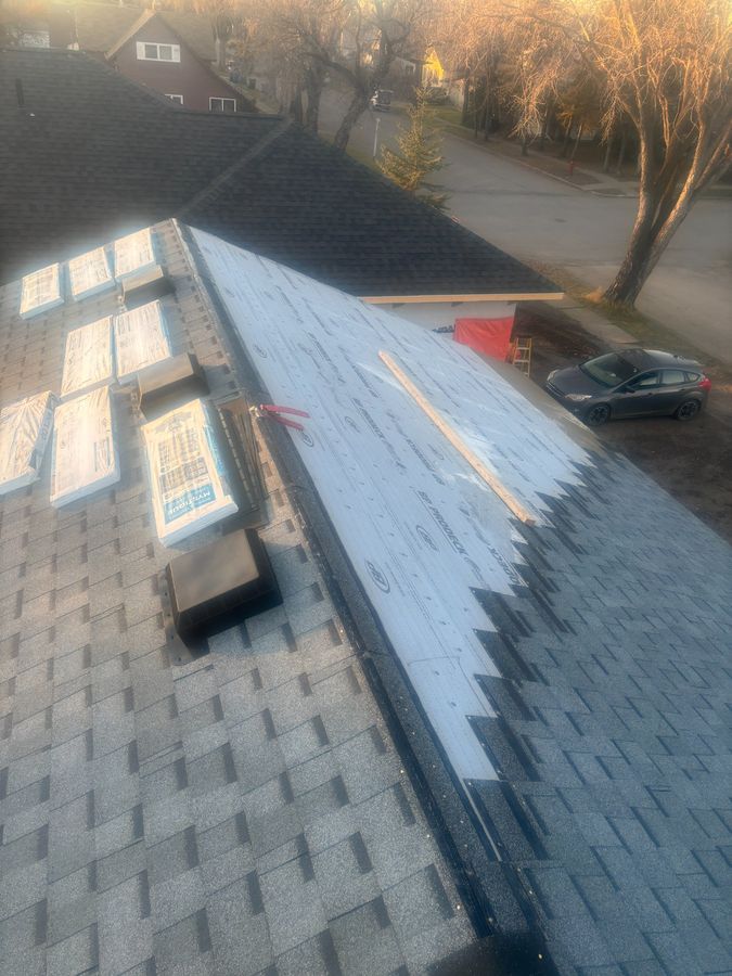 Roof repair in progress with new shingle bundles staged and underlayment visible in Yorkton Saskatchewan