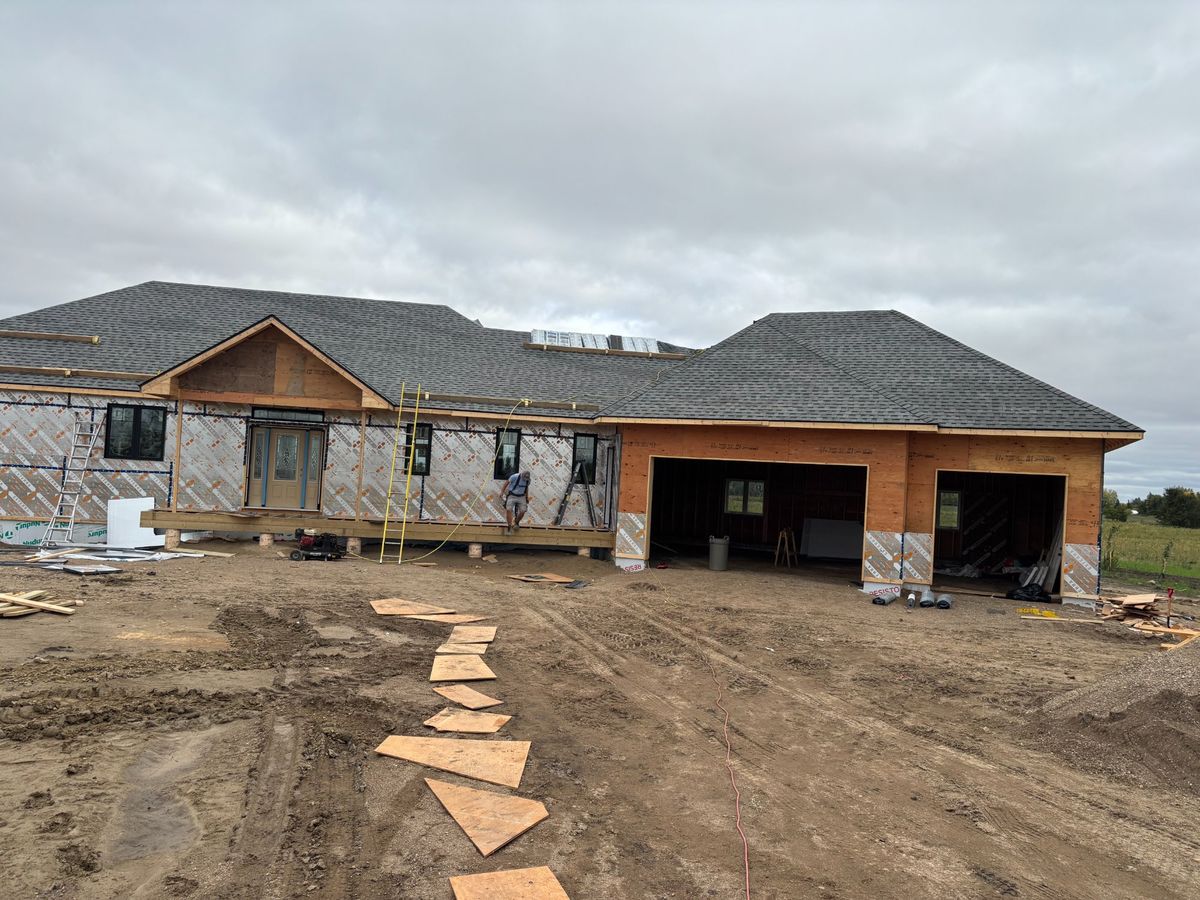 New construction custom home front view with nearly completed roof near Churchbridge Saskatchewan
